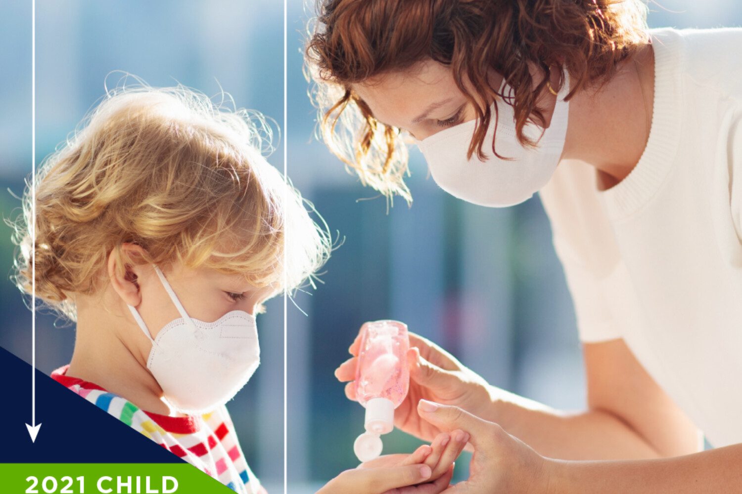 image of a woman in a mask putting hand sanitizer on a child in a mask's hands
