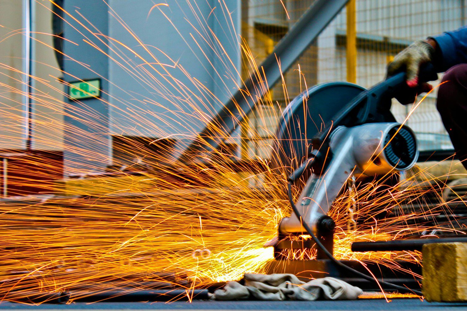 close up of a saw cutting with sparks flying