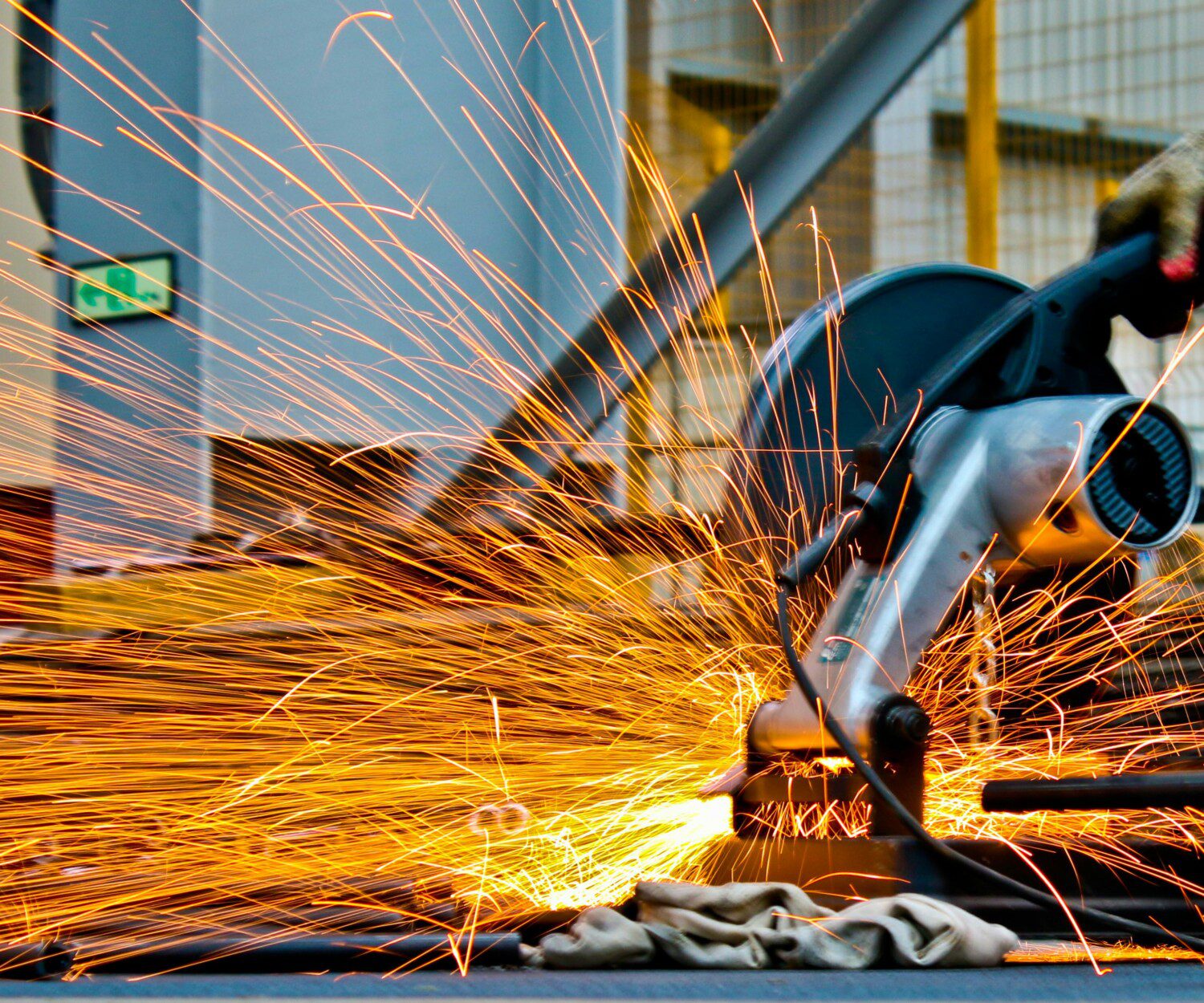 close up of a saw cutting with sparks flying