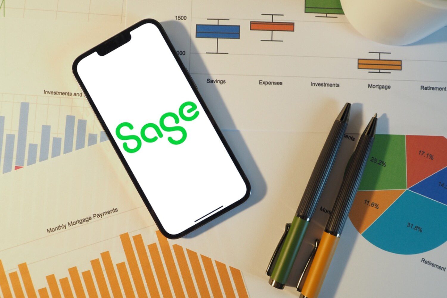 iPhone showing the Sage logo on top of papers