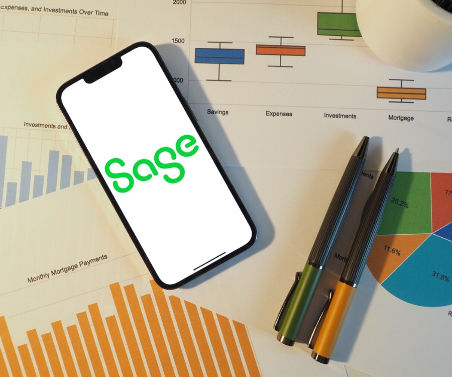 iPhone showing the Sage logo on top of papers