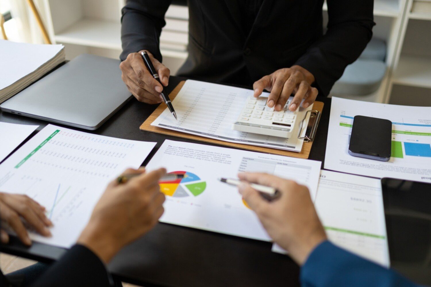 People Looking Over Financial Statements