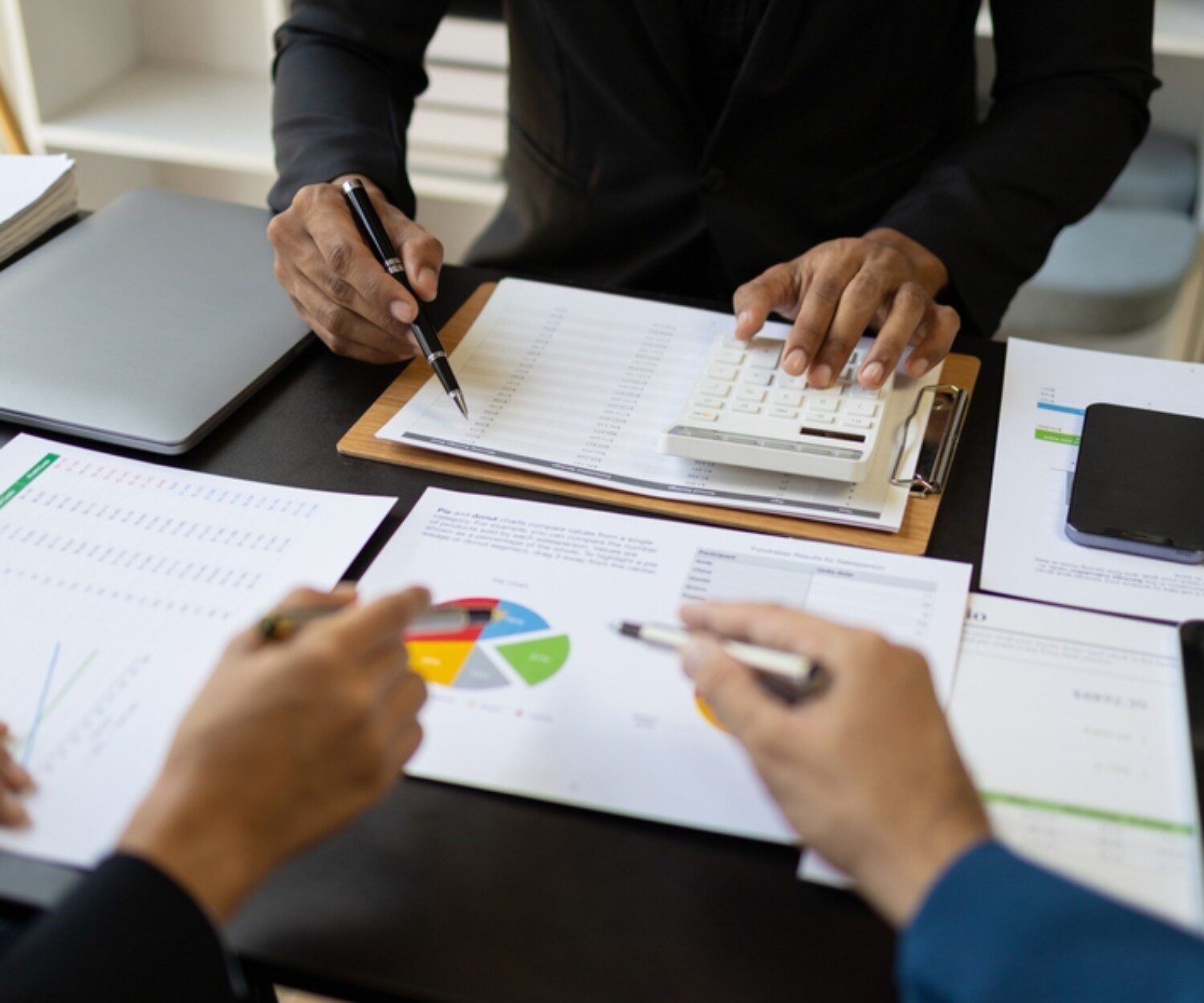 People Looking Over Financial Statements