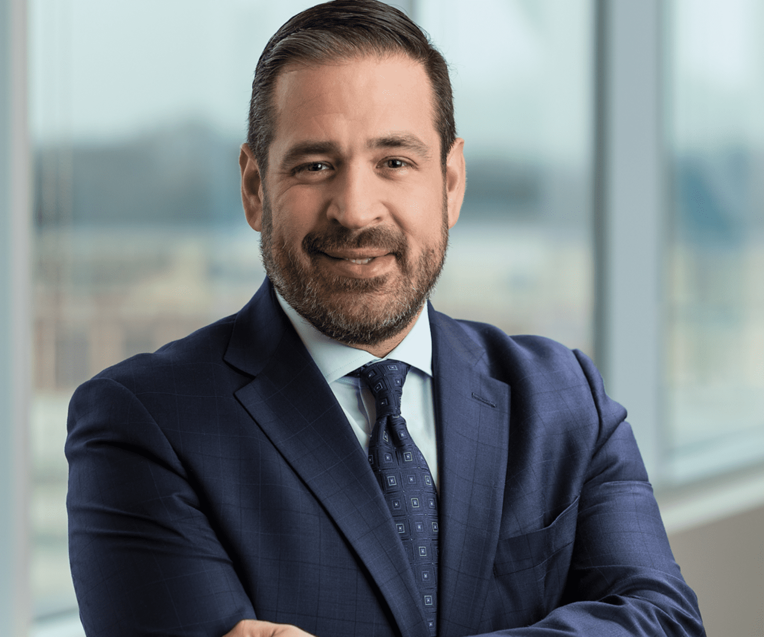 Headshot of a man in a suit