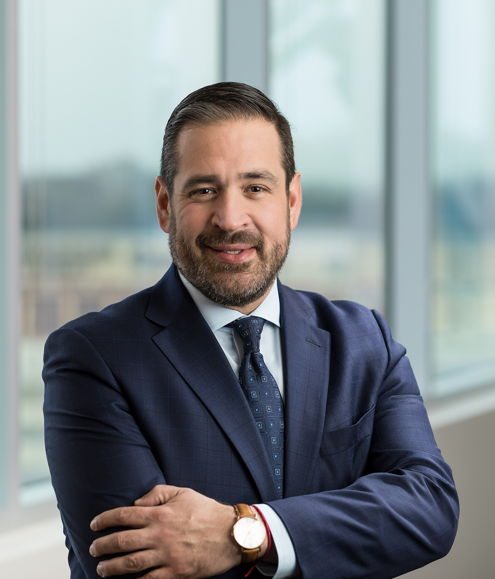 Headshot of a man in a suit
