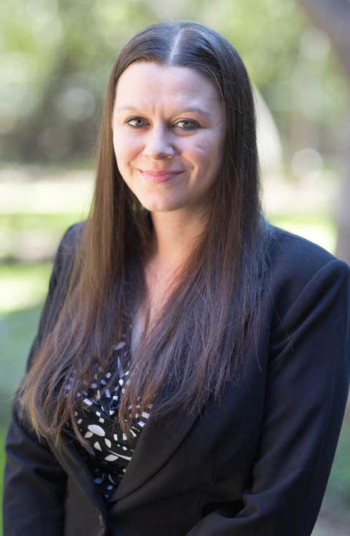 headshot of a woman outside