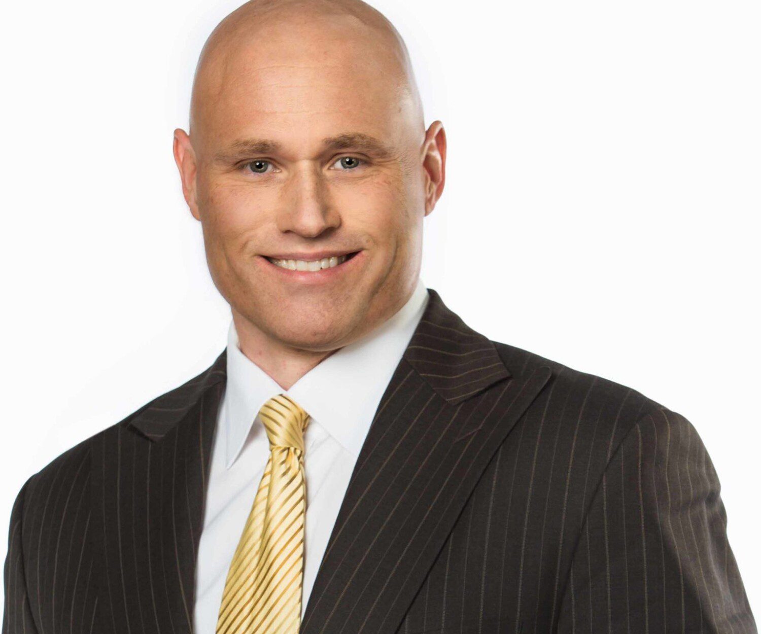 Headshot of a man in a suit on a white background