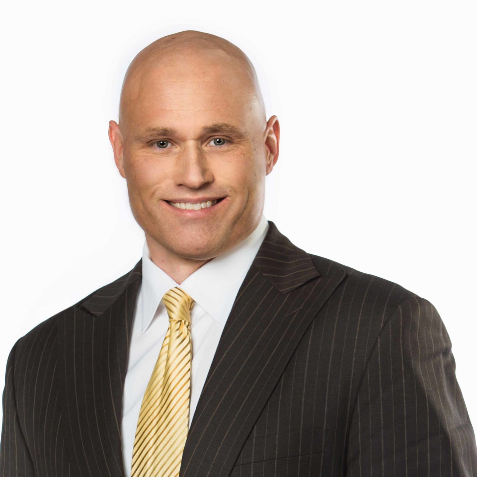 Headshot of a man in a suit on a white background