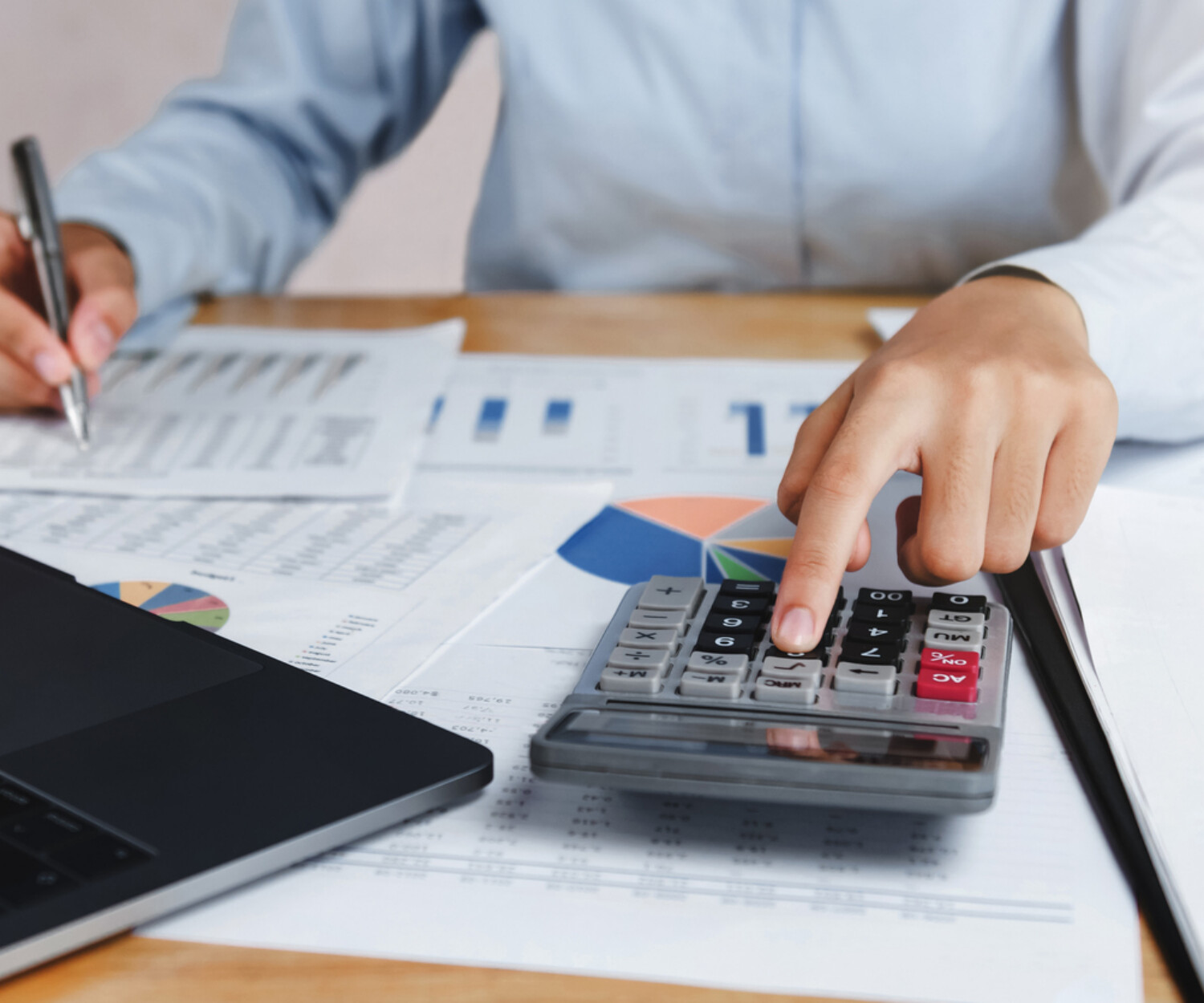 Government contractor reviewing financial records and calculating incurred cost submission for DCAA compliance.